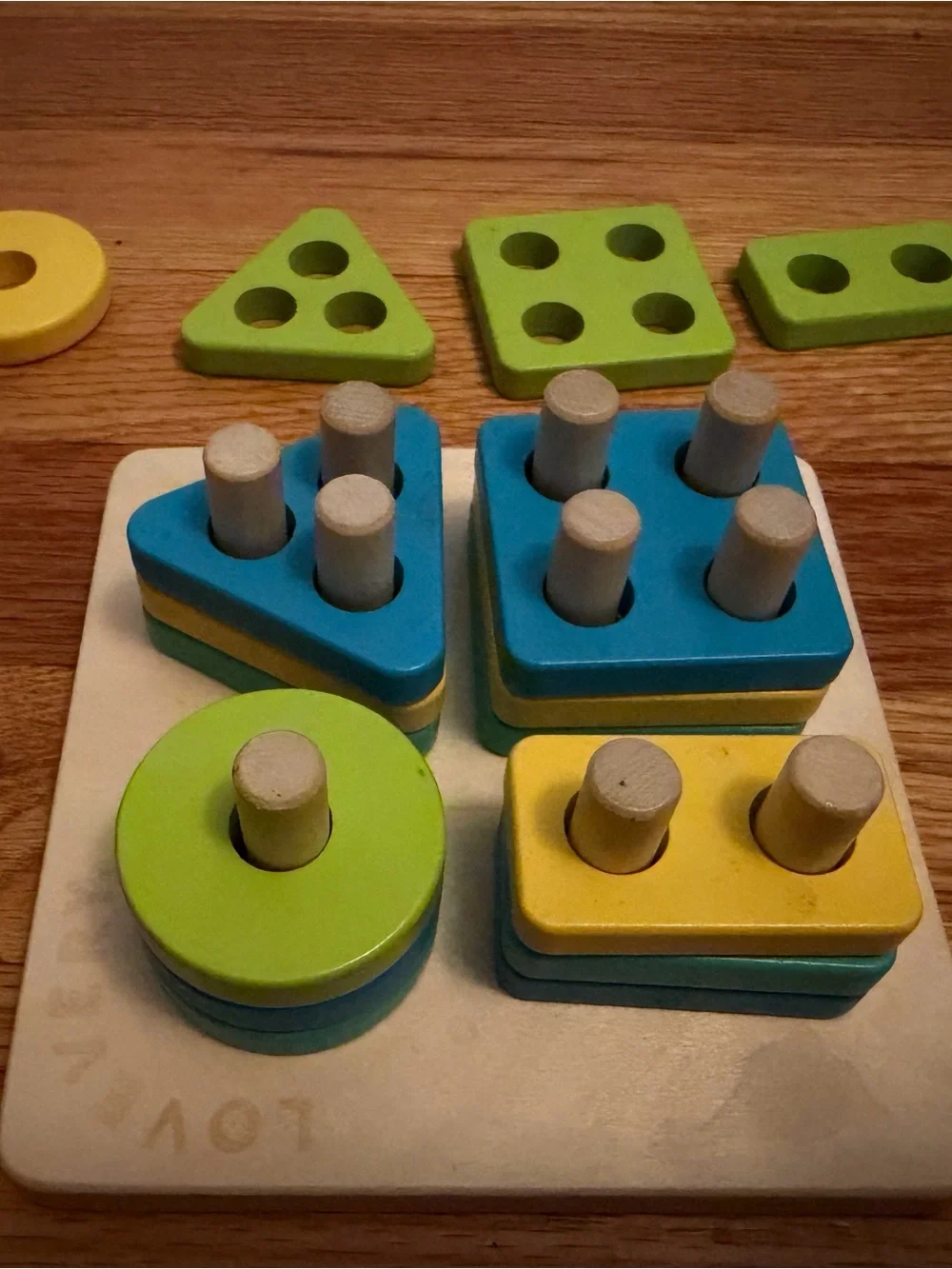 Lovevery Wooden Shape Stacking Puzzle - Blue, Yellow, Green and Teal